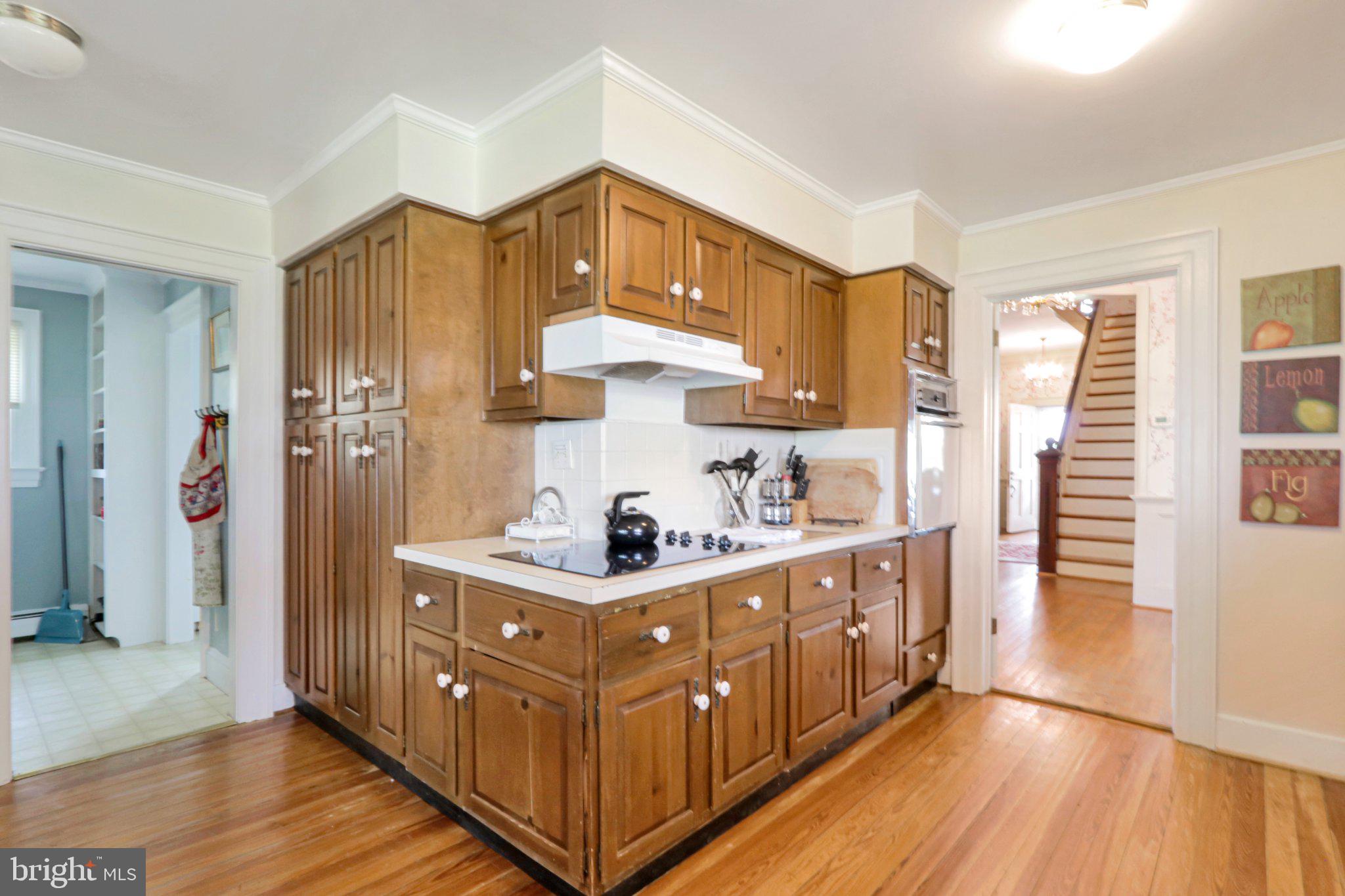 2598 Cherrystone Road Cape Charles, VA 23310 - Photo 22 of 47 Charming kitchen with rich wood cabinetry.