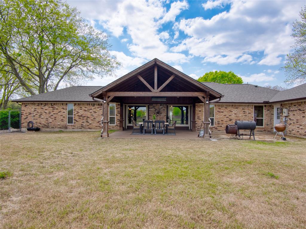 10 Citrus Way Lucas, TX 75002 - Photo 29 of 34 Back of property featuring a patio, a yard, and brick siding