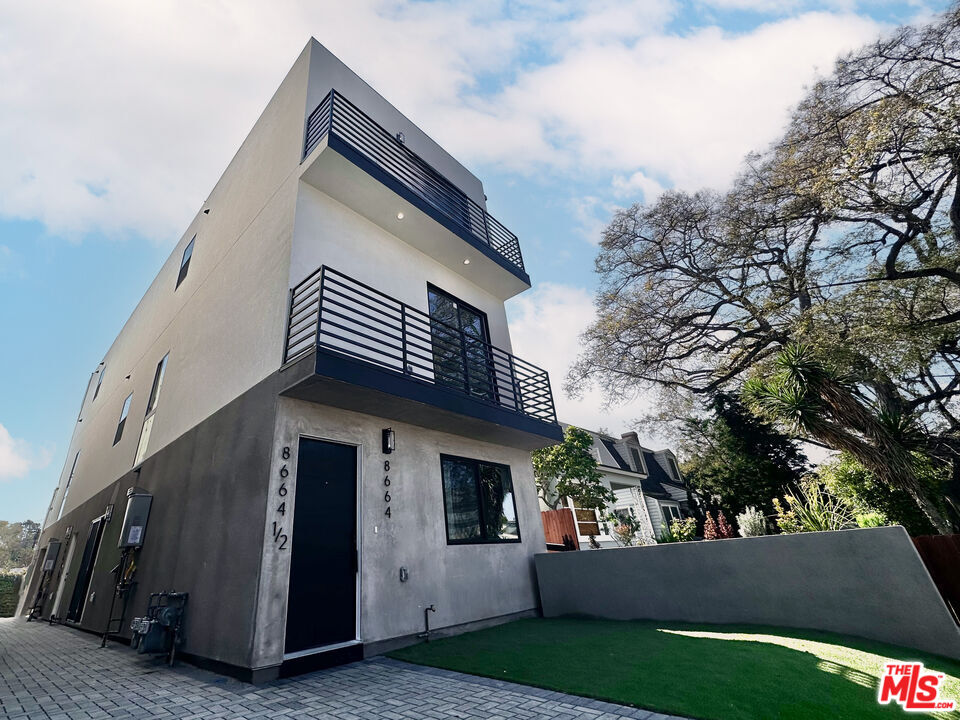 a view of house with yard