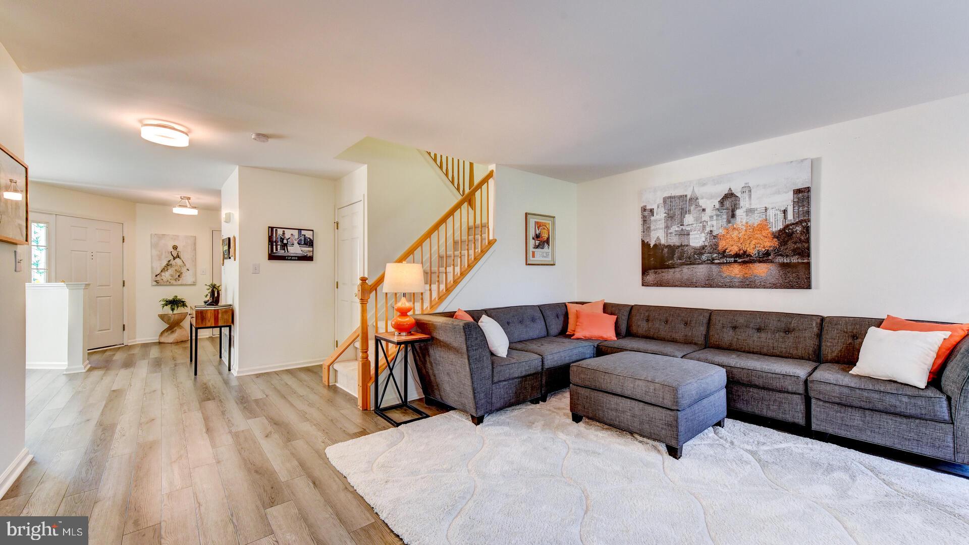 104 Coburn Road Pennington, NJ 08534 - Photo 11 of 40 a living room with furniture and a wooden floor