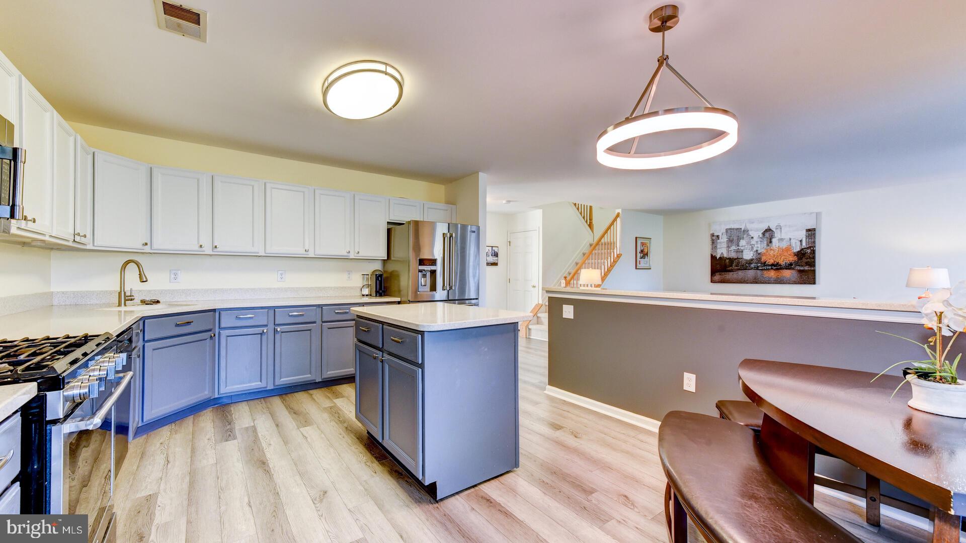 104 Coburn Road Pennington, NJ 08534 - Photo 16 of 40 a kitchen with a refrigerator and a sink
