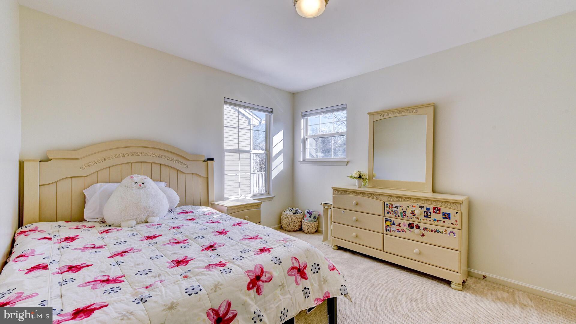 104 Coburn Road Pennington, NJ 08534 - Photo 28 of 40 a bedroom with a bed and a dresser
