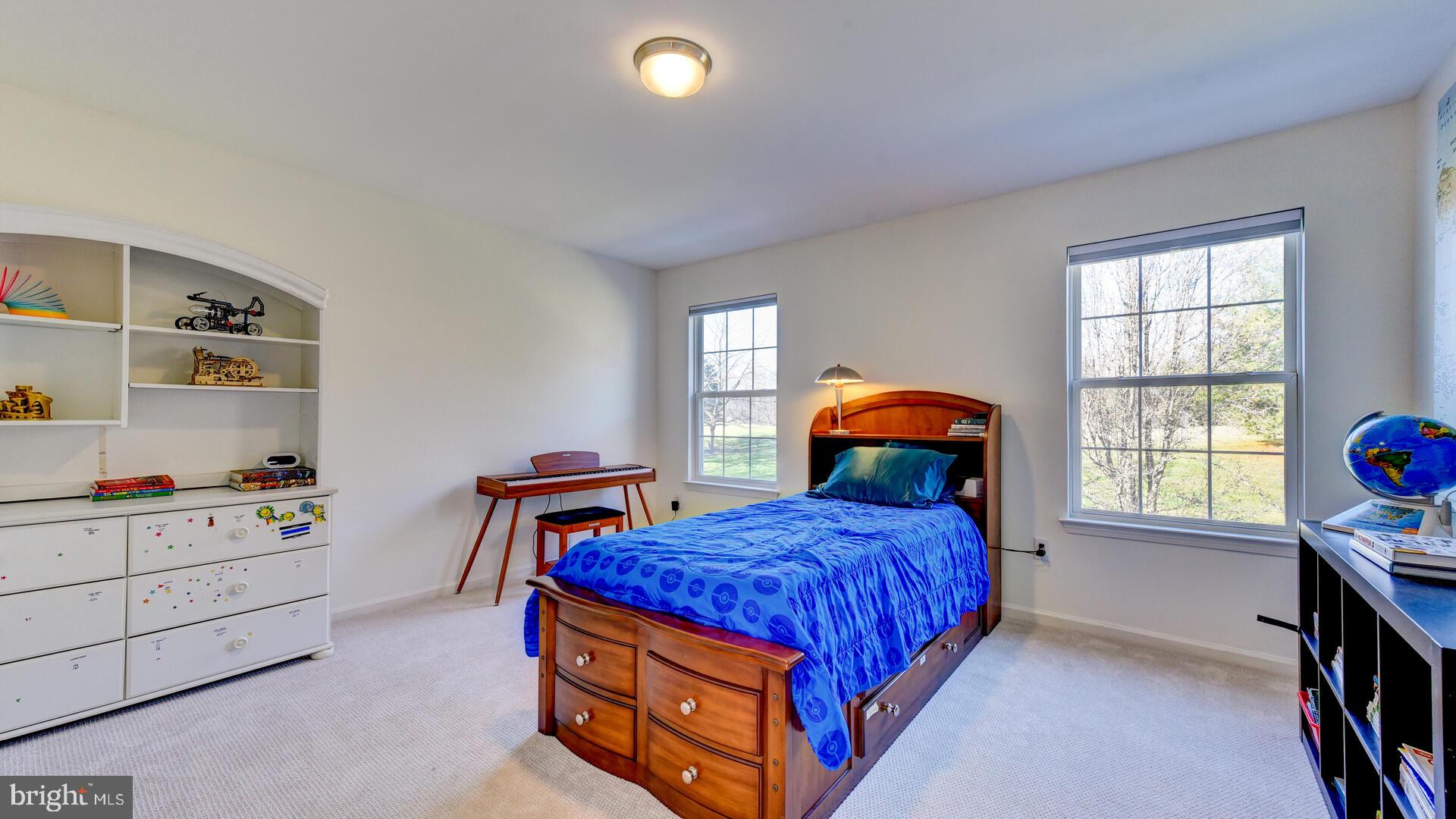 104 Coburn Road Pennington, NJ 08534 - Photo 29 of 40 a bedroom with a bed and a window in it