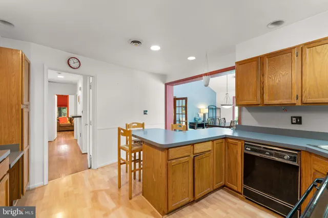 a kitchen with stainless steel appliances granite countertop a stove and a sink