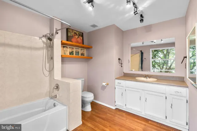 a view of a door and wooden floor