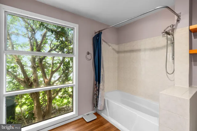 a bed room with a bed and a window