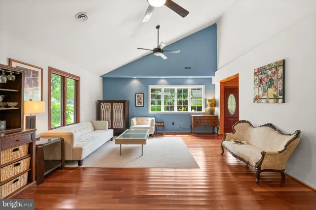 a living room with furniture window and wooden floor