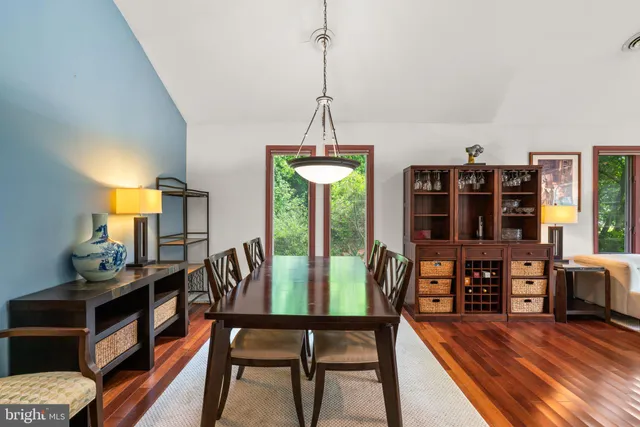 a view of a dining room with furniture and window