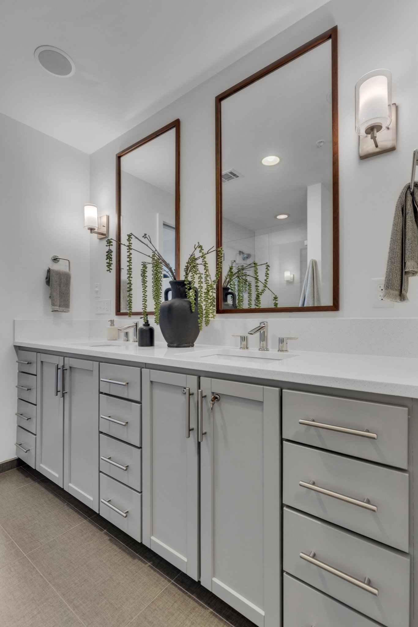 1212 Laurel Street, Unit 1815 Nashville, TN 37203 - Photo 14 of 42 a bathroom with a double vanity sink and a mirror