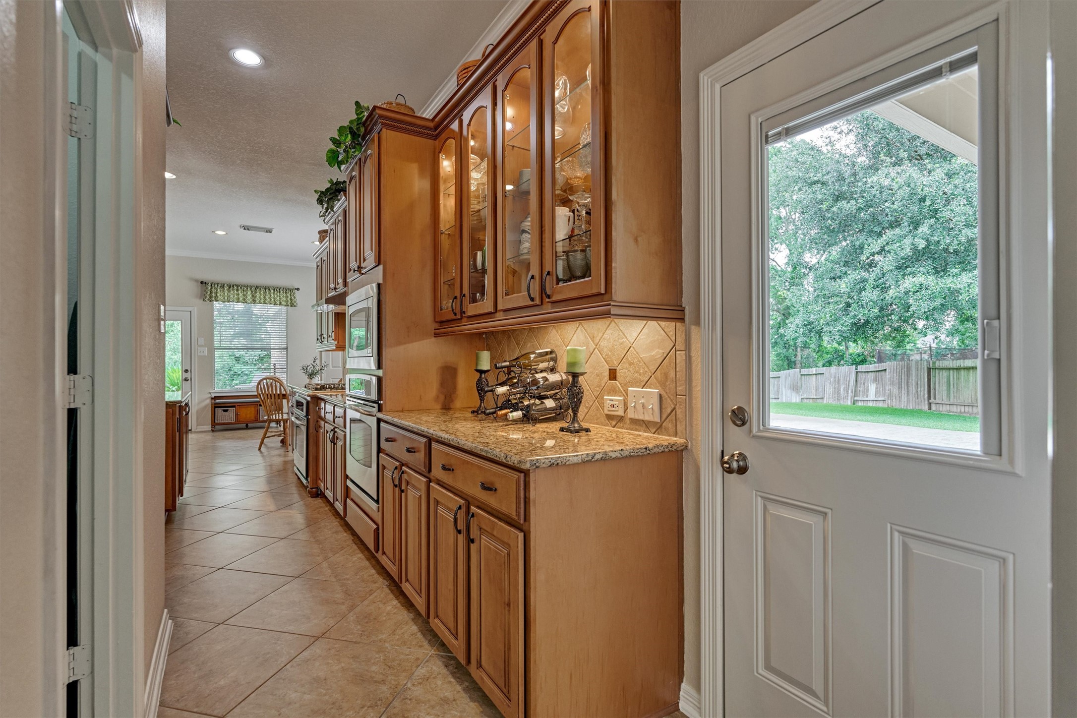 2500 Eagle Post Drive Conroe, TX 77304 - Photo 13 of 50 Convenient access from the kitchen to the motor court and additional 2 car garage. Note the glass front buffet for additional storage of serving pieces.