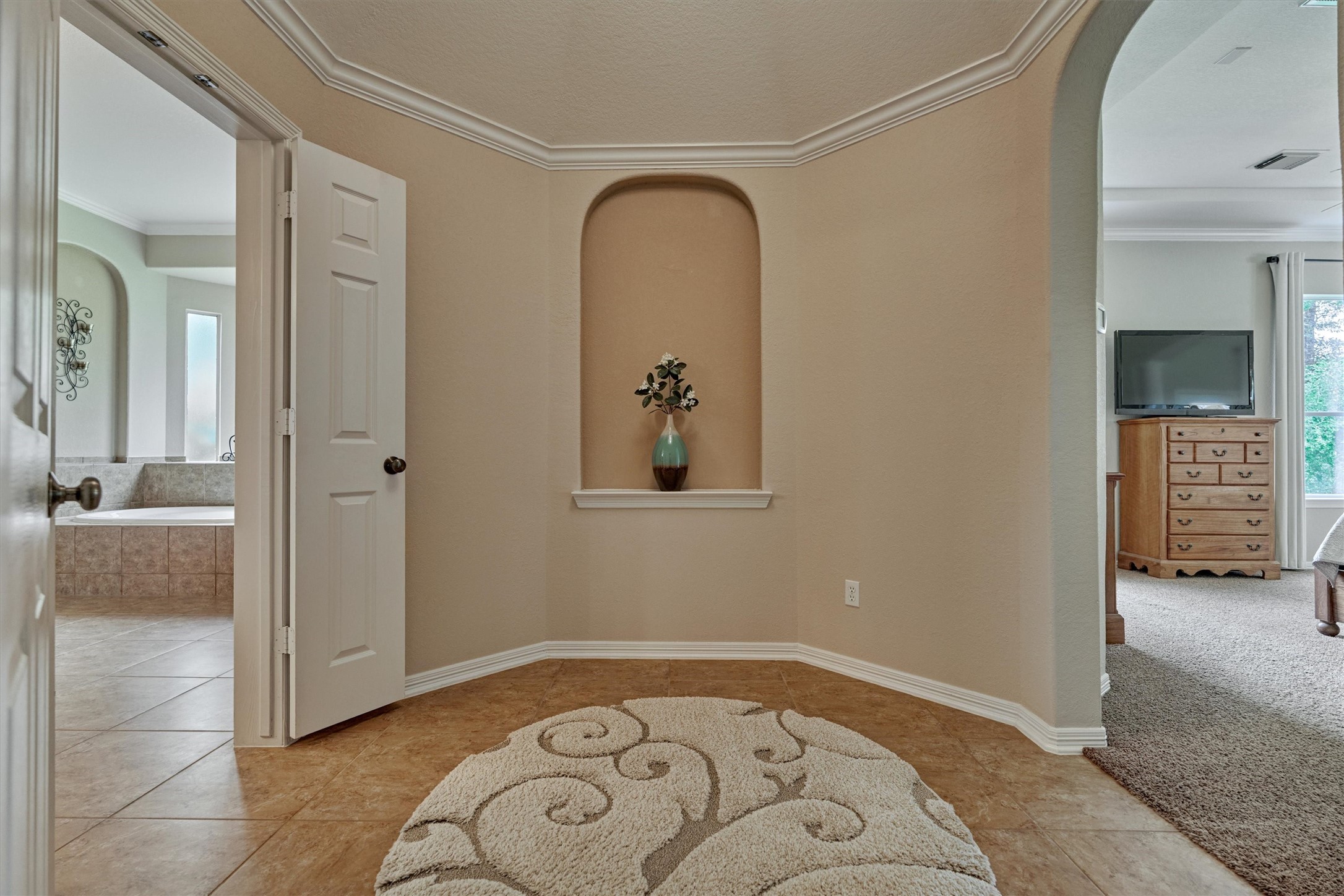 2500 Eagle Post Drive Conroe, TX 77304 - Photo 21 of 50 Striking rotunda hallway leads to luxe primary bath.