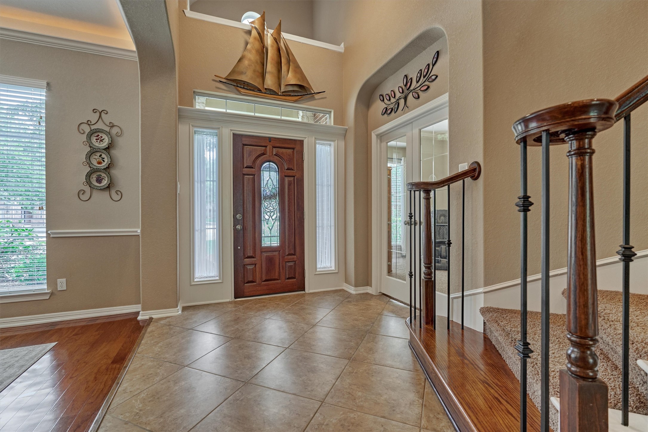 2500 Eagle Post Drive Conroe, TX 77304 - Photo 24 of 50 As we make our way back towards the front of the home, note the study with French doors to the right and dining room to your left. Natural light floods this gorgeous home!