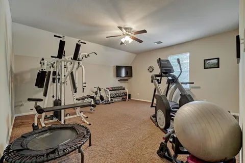 a view of a room with gym equipment