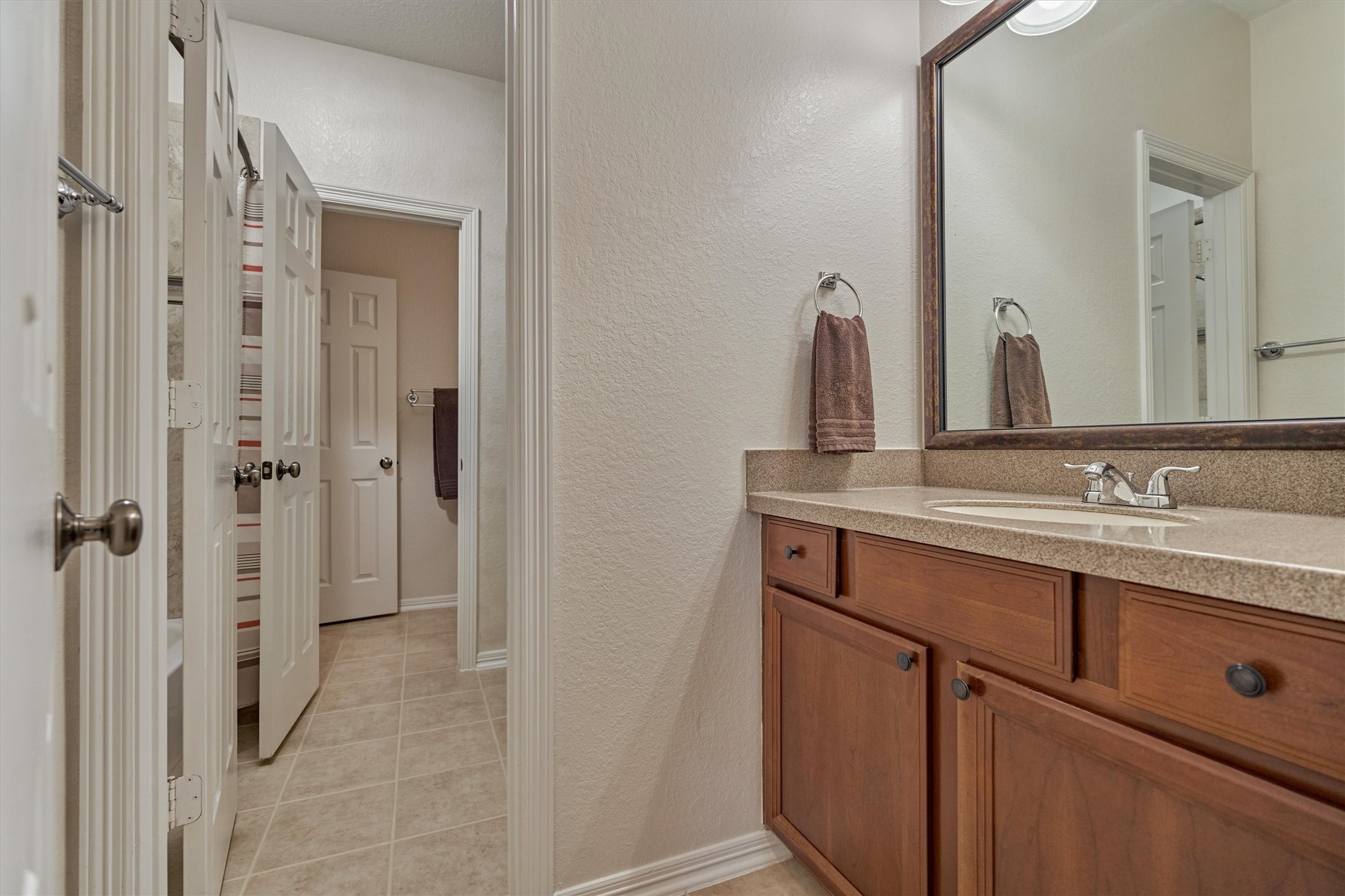 2500 Eagle Post Drive Conroe, TX 77304 - Photo 35 of 50 Easy access to full bath on the guest room wing offers private vanity area with storage.