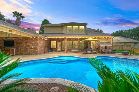 a view of a house with swimming pool