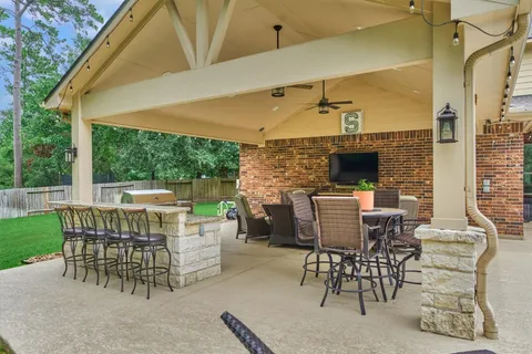 a view of a patio with a table and chairs