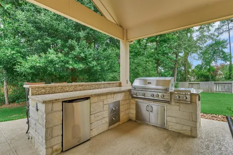 a view of a kitchen with a stove top oven and garden