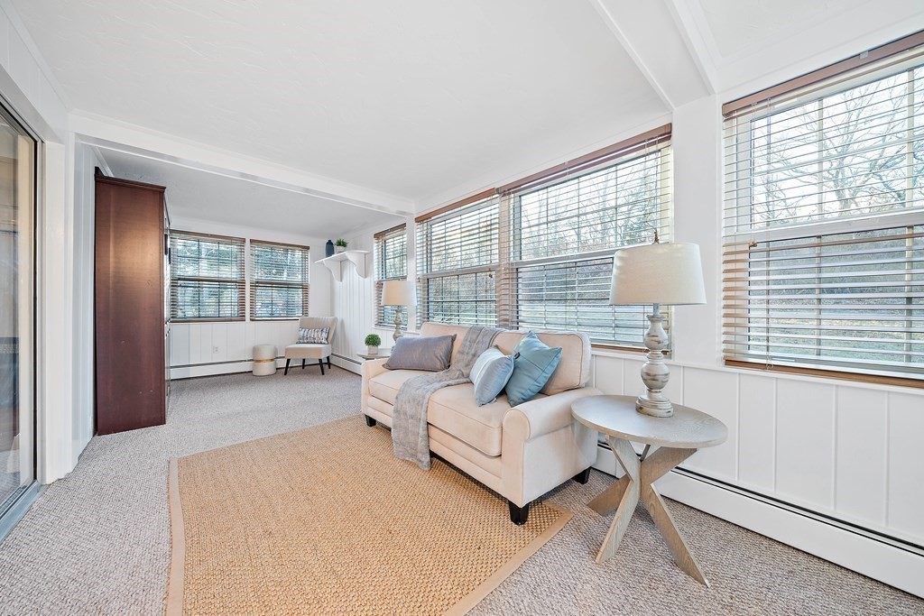 125 Driftway Scituate, MA 02066 - Photo 12 of 35 a living room with furniture and a window