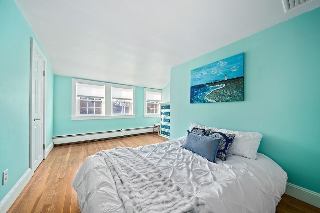 125 Driftway Scituate, MA 02066 - Photo 15 of 35 a bedroom with bed window and couch