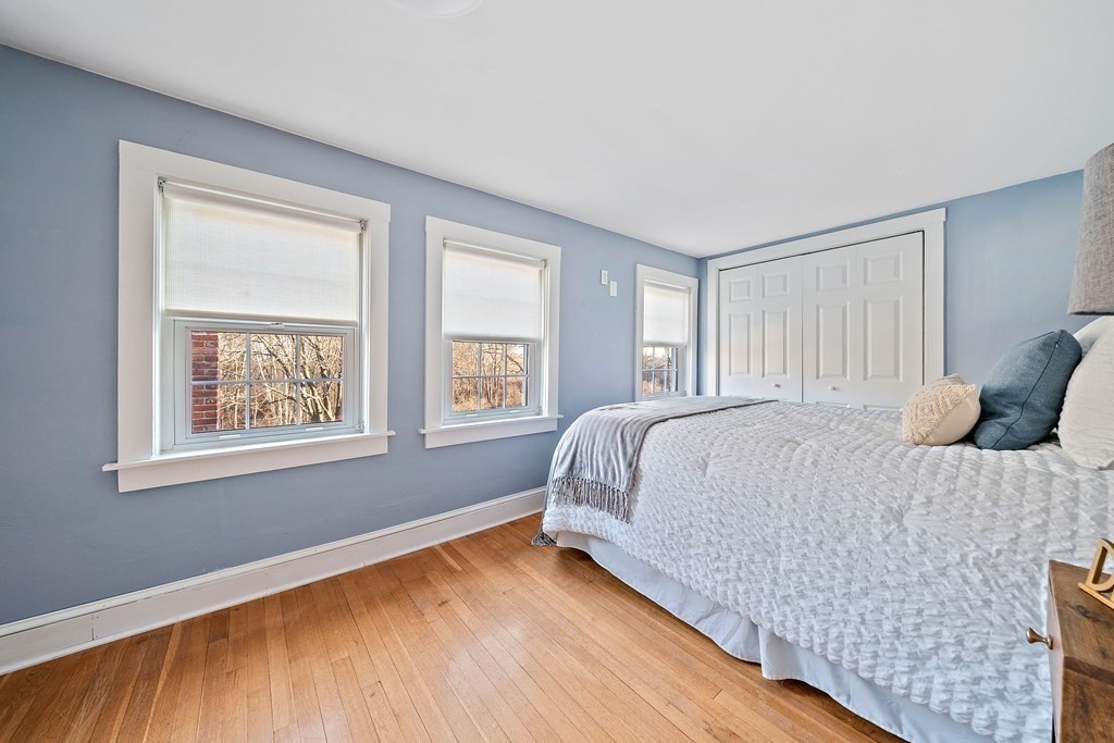 125 Driftway Scituate, MA 02066 - Photo 16 of 35 a spacious bedroom with a bed and a window