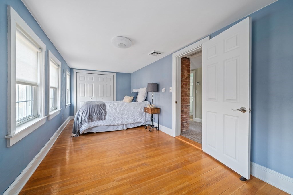 125 Driftway Scituate, MA 02066 - Photo 17 of 35 a bedroom with furniture and a large window