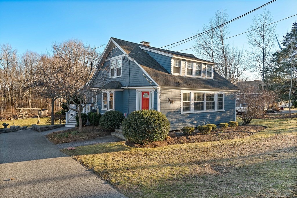 125 Driftway Scituate, MA 02066 - Photo 2 of 35 a front view of a house with a yard