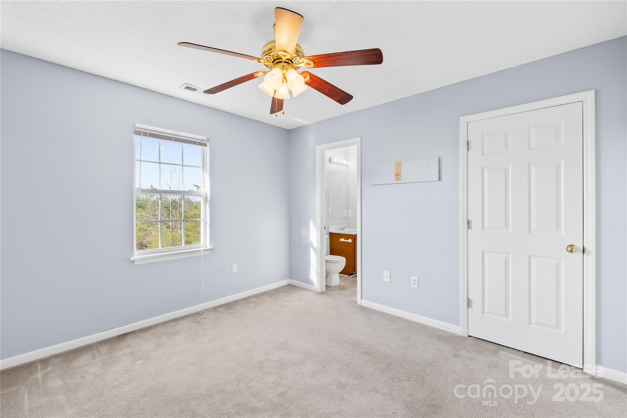 7610 Sarah Drive Denver, NC 28037 - Photo 12 of 17 a view of an empty room with a window