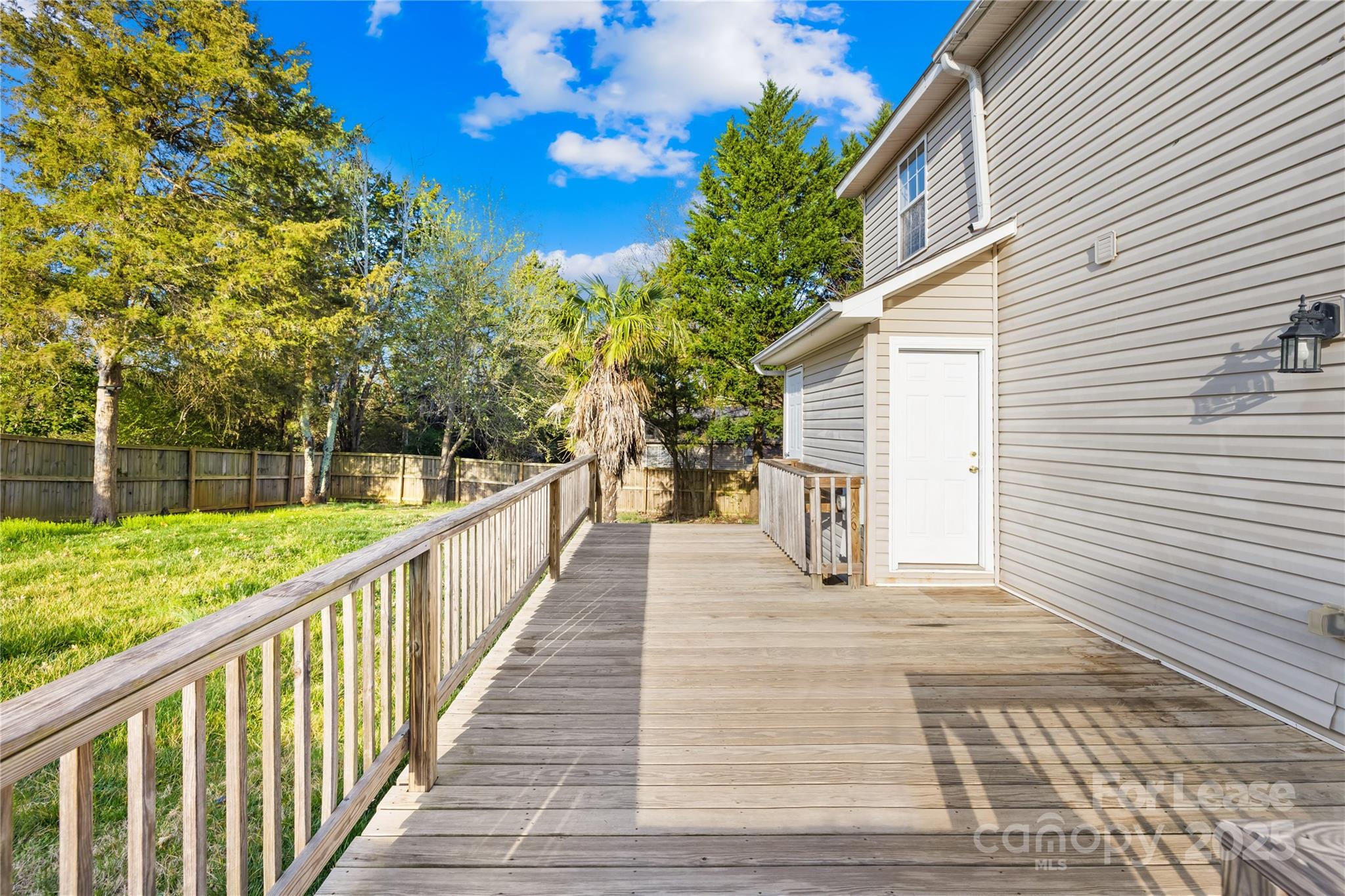 7610 Sarah Drive Denver, NC 28037 - Photo 13 of 17 a view of a house with backyard and deck