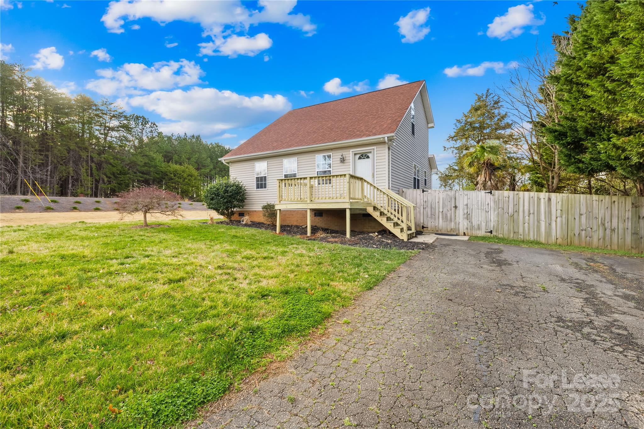 7610 Sarah Drive Denver, NC 28037 - Photo 15 of 17 a view of a house with a yard