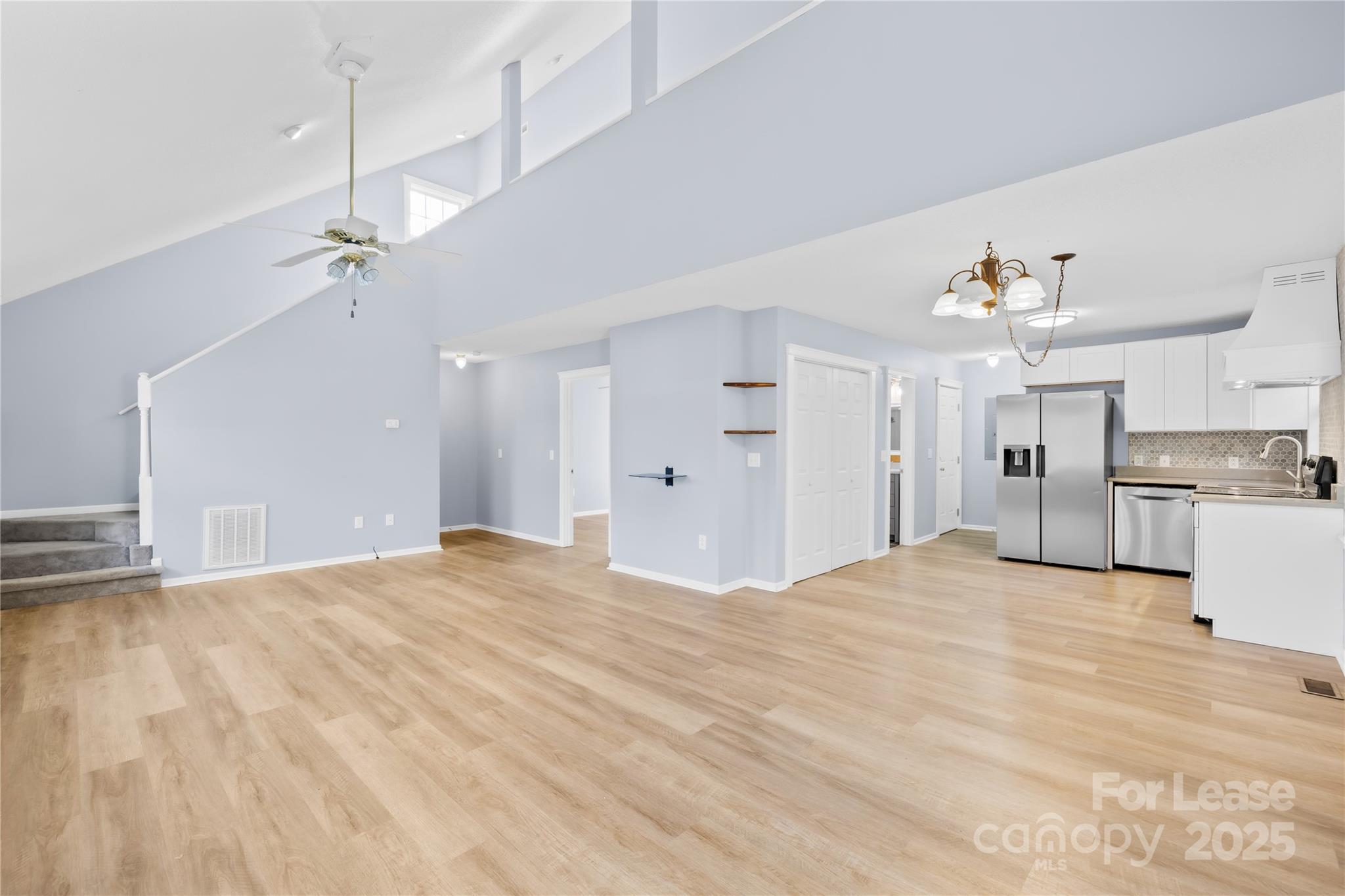 7610 Sarah Drive Denver, NC 28037 - Photo 2 of 17 a large white bed in a white room