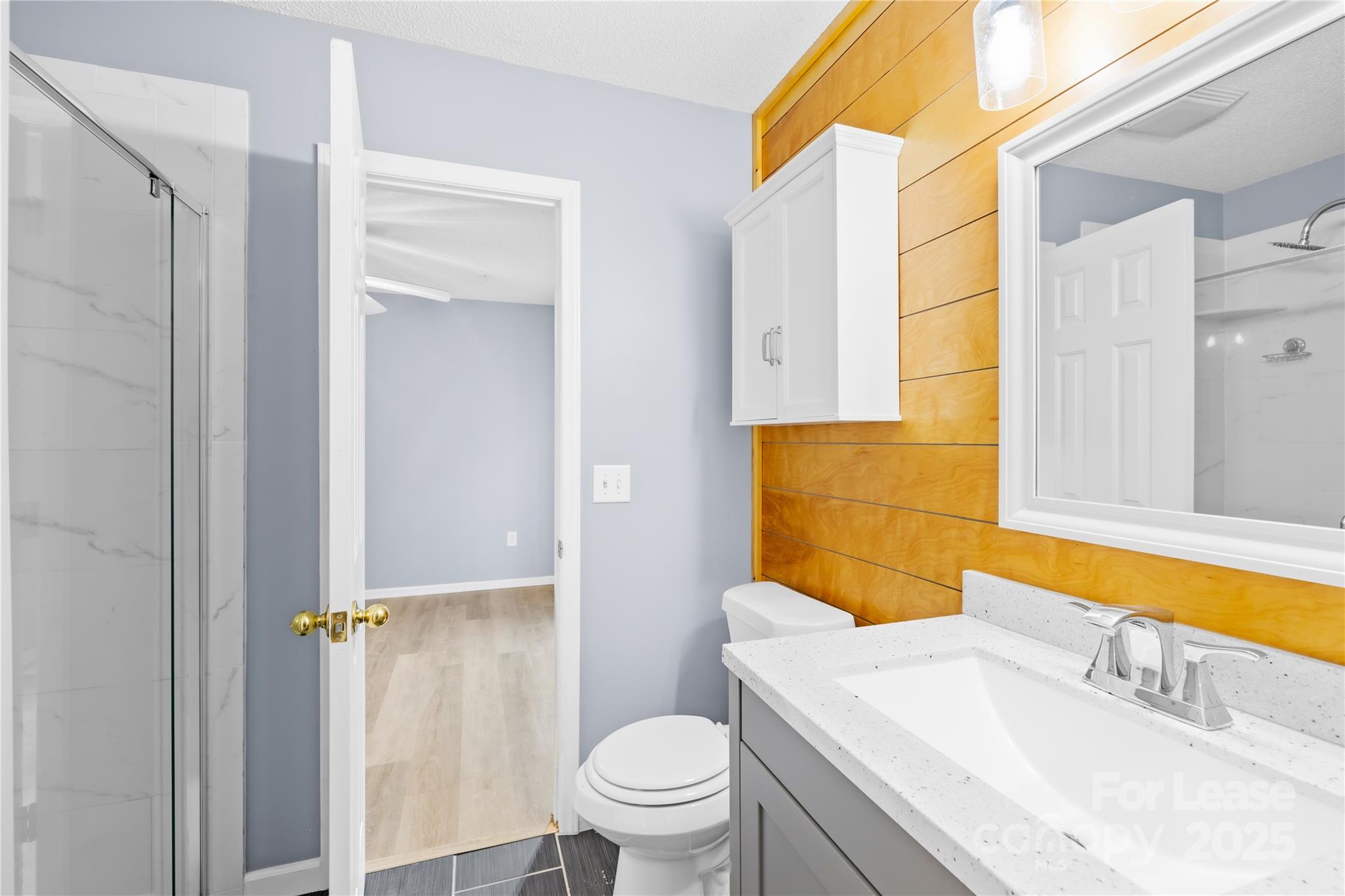 7610 Sarah Drive Denver, NC 28037 - Photo 9 of 17 a bathroom with a sink toilet and shower