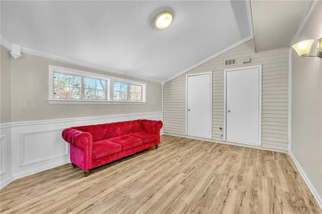 a living room with hard wood floors and a couch