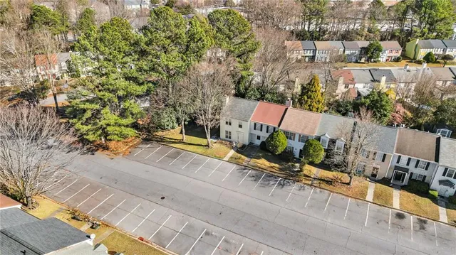 a view of a terrace with a bench and trees around