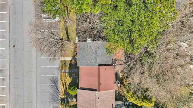 an aerial view of residential houses with outdoor space