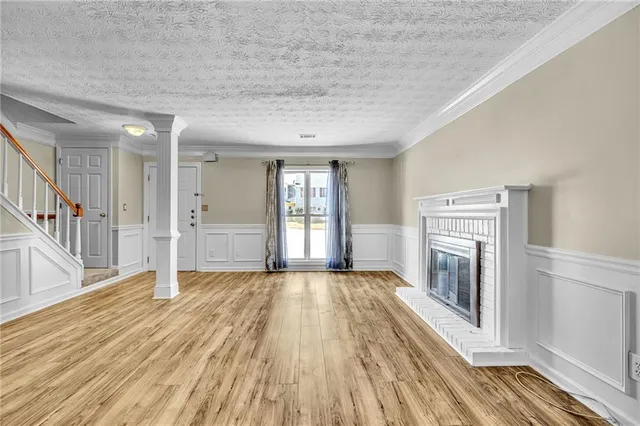 a view of a livingroom with wooden floor