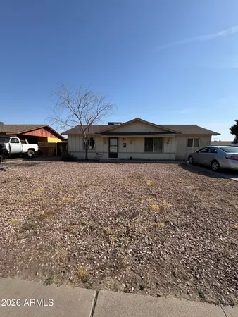 a view of a car parked in front of a house