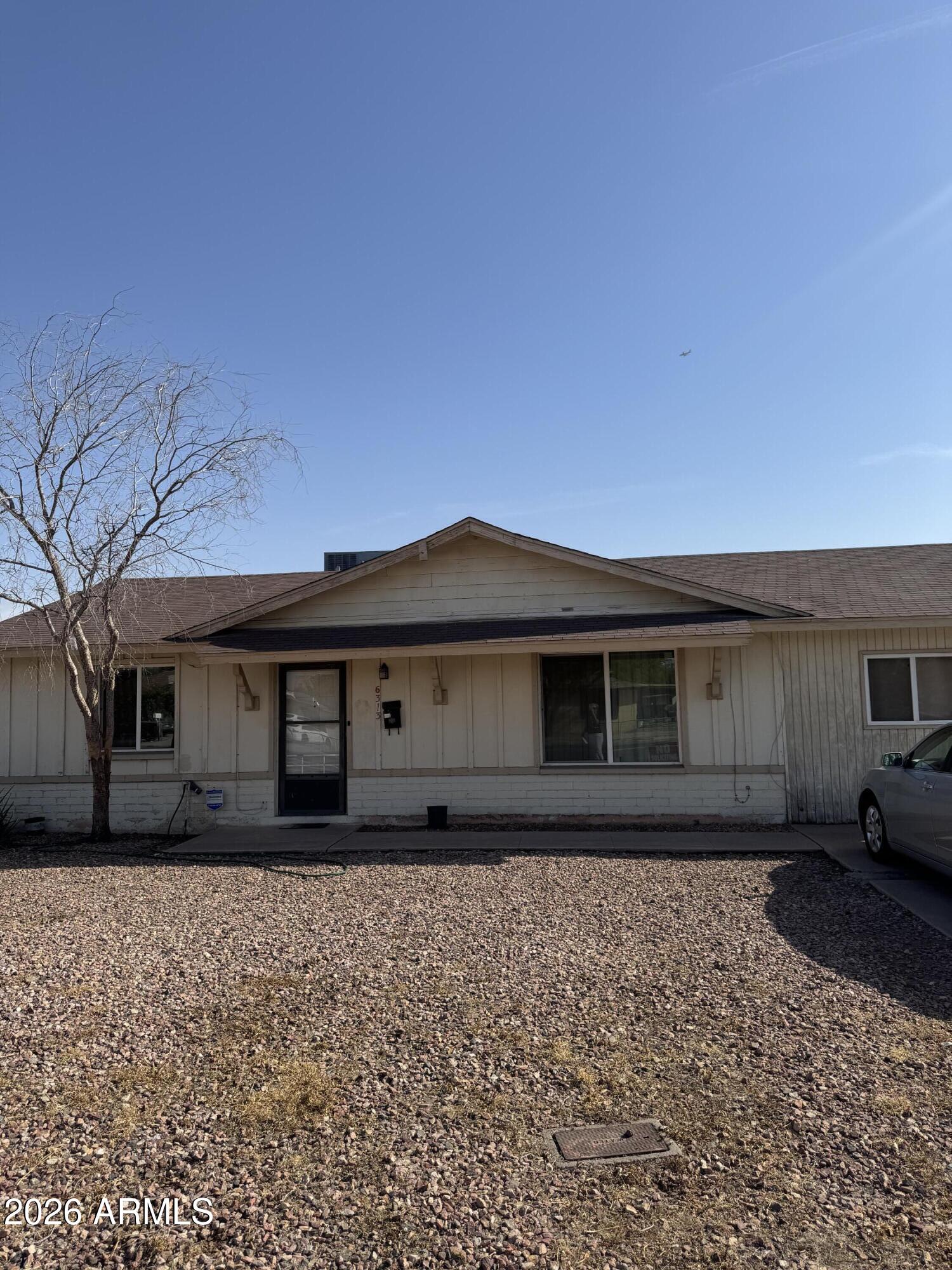 6313 West Osborn Road Phoenix, AZ 85033 - Photo 12 of 12 a front view of a house with a yard