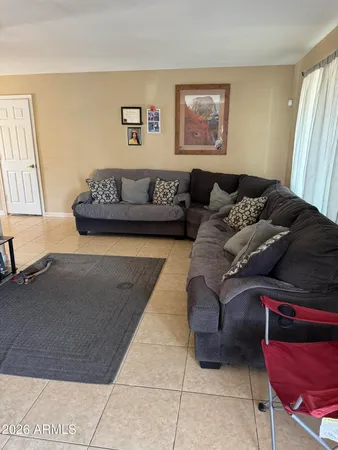 a living room with furniture and a couch
