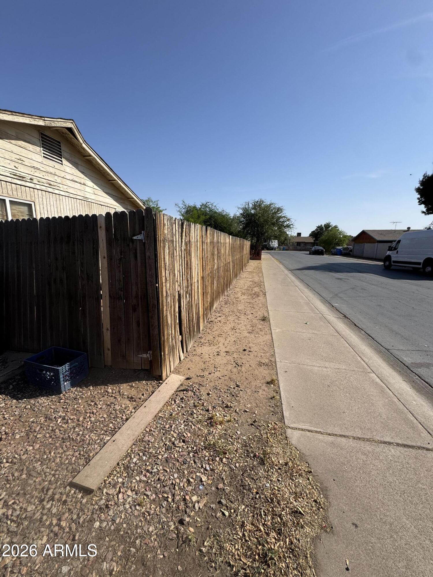 6313 West Osborn Road Phoenix, AZ 85033 - Photo 9 of 12 a view of balcony with wooden floor and fence