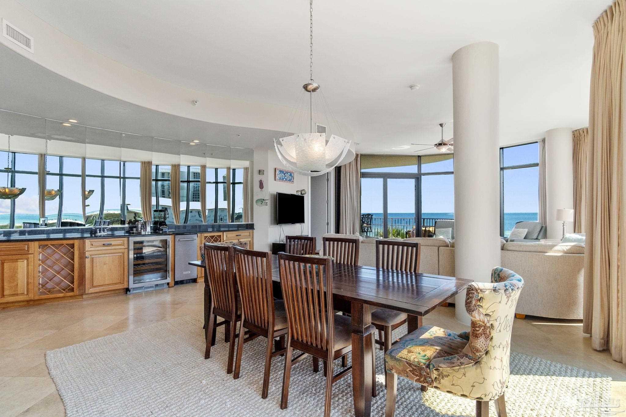 16551 Perdido Key Drive, Unit 202 Perdido Key, FL 32507 - Photo 11 of 54 a view of a dining room with furniture window and wooden floor