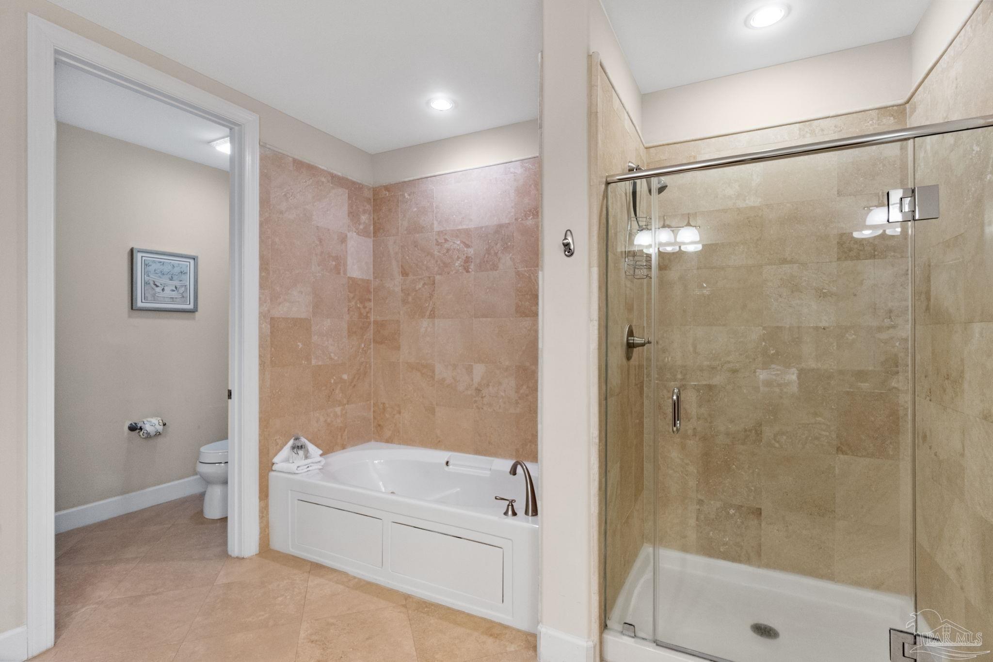 16551 Perdido Key Drive, Unit 202 Perdido Key, FL 32507 - Photo 26 of 54 a bathroom with a bathtub and a shower