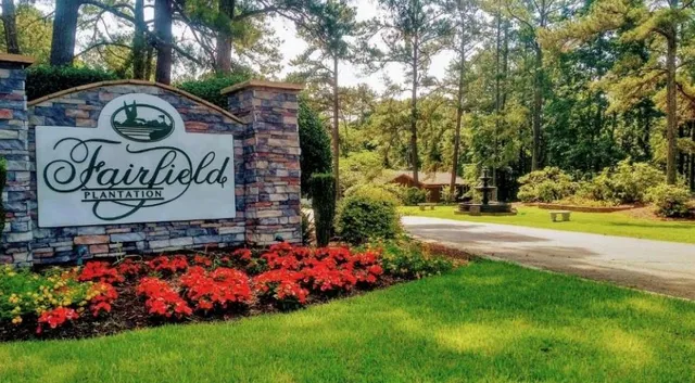 a view of outdoor space with garden and trees