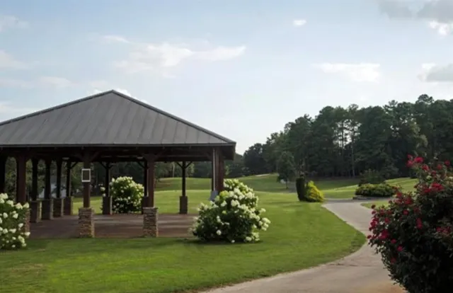 a front view of house with a garden