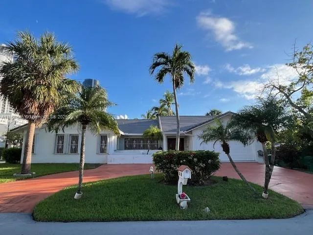 a house with palm tree in front of it