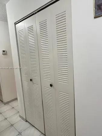 a bathroom with a glass door shower