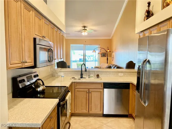 a kitchen with a sink and a refrigerator