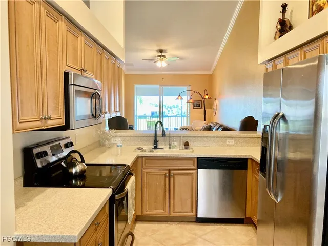 a kitchen with a sink and a refrigerator