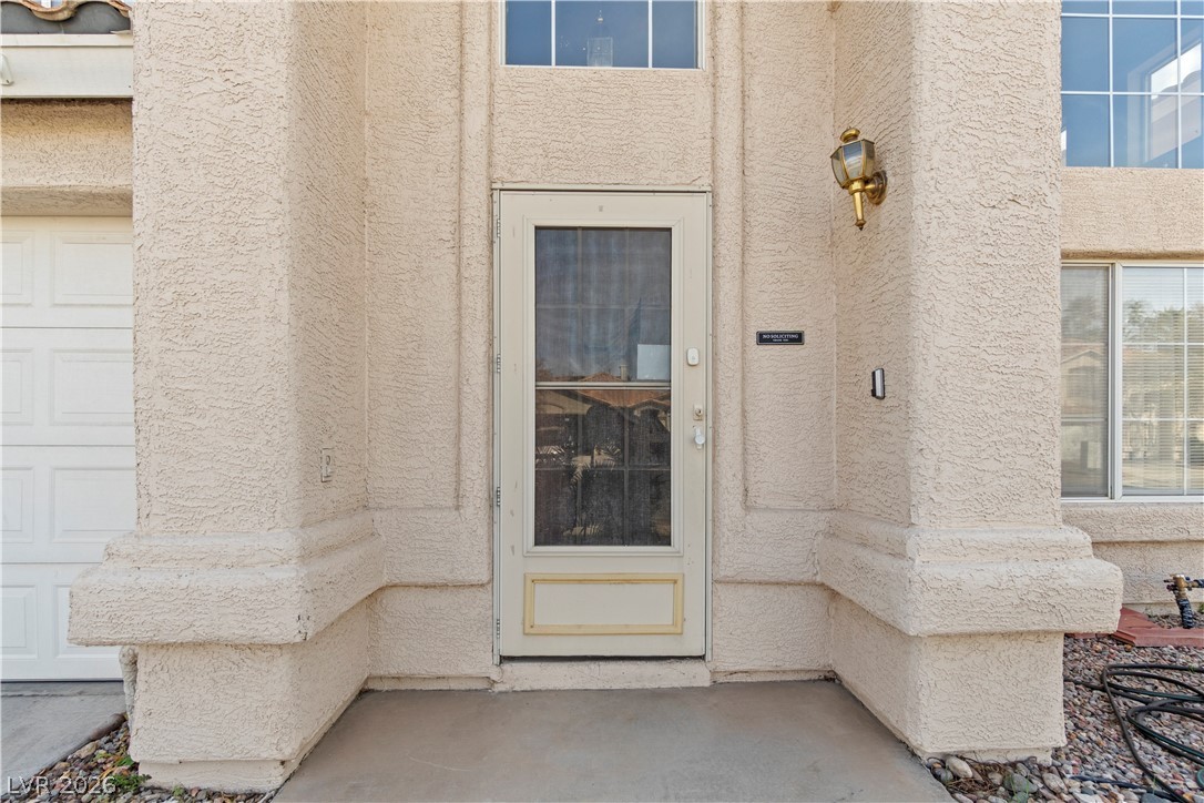 1419 Red Sunset Avenue Henderson, NV 89074 - Photo 3 of 35 Entrance to property featuring stucco siding