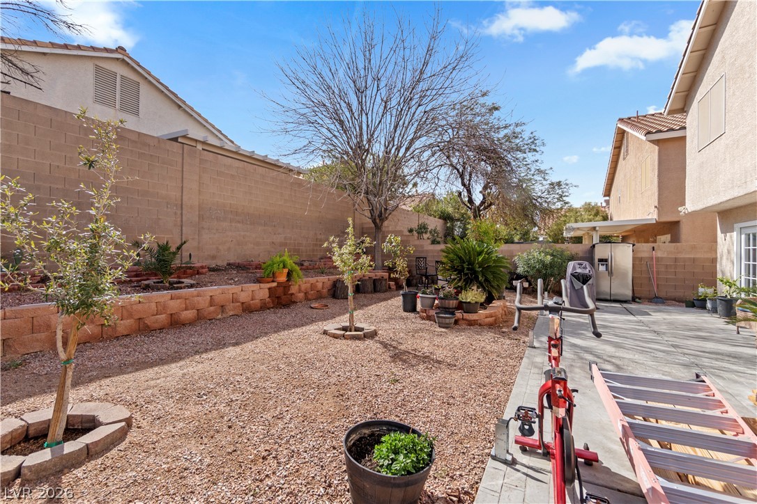 1419 Red Sunset Avenue Henderson, NV 89074 - Photo 35 of 35 Fenced backyard with a patio