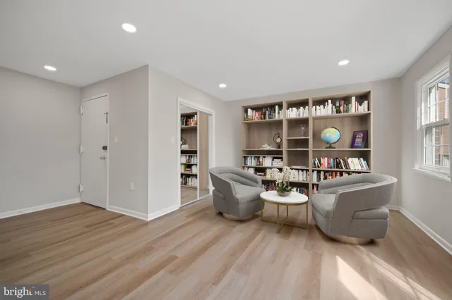 front view of a brick house with a yard